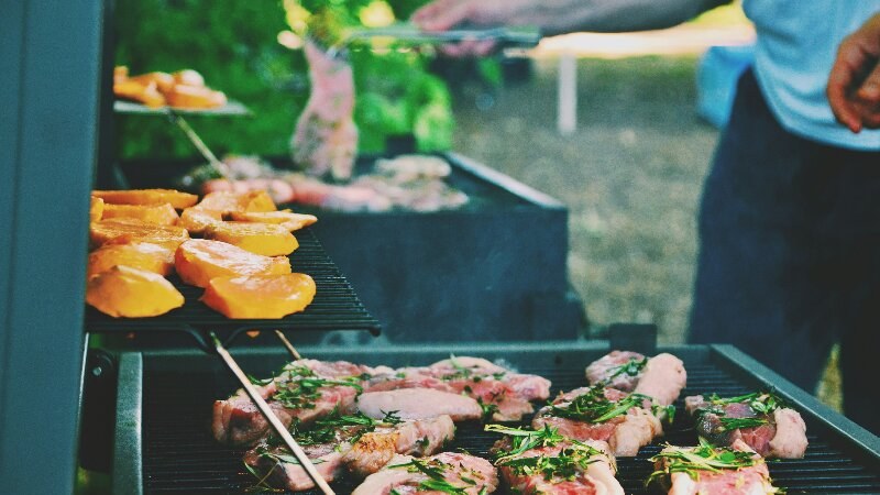 Person grilling on a bbq grill