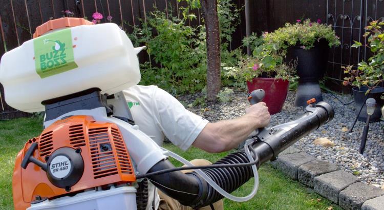 Buzz Boss technician spraying for pests