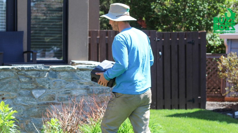 Buzz Boss worker preparing a pest trap