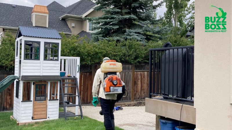 Buzz Boss worker spraying for ticks and other pests